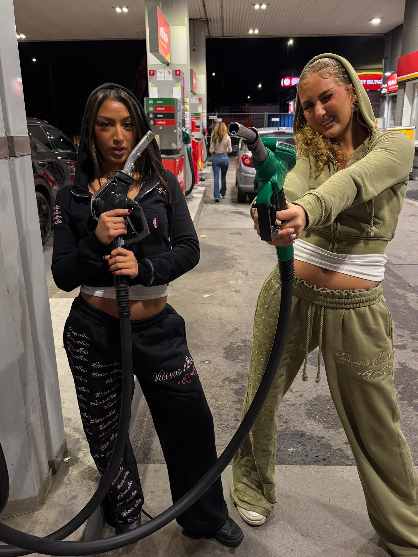 Two Vicious Villains models wearing embroidered tracksuits